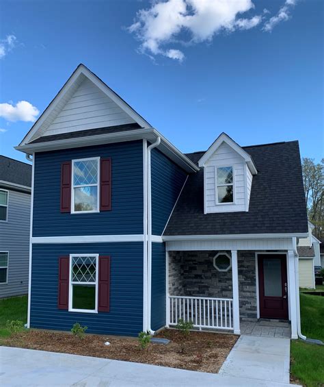 navy blue dark vinyl siding.